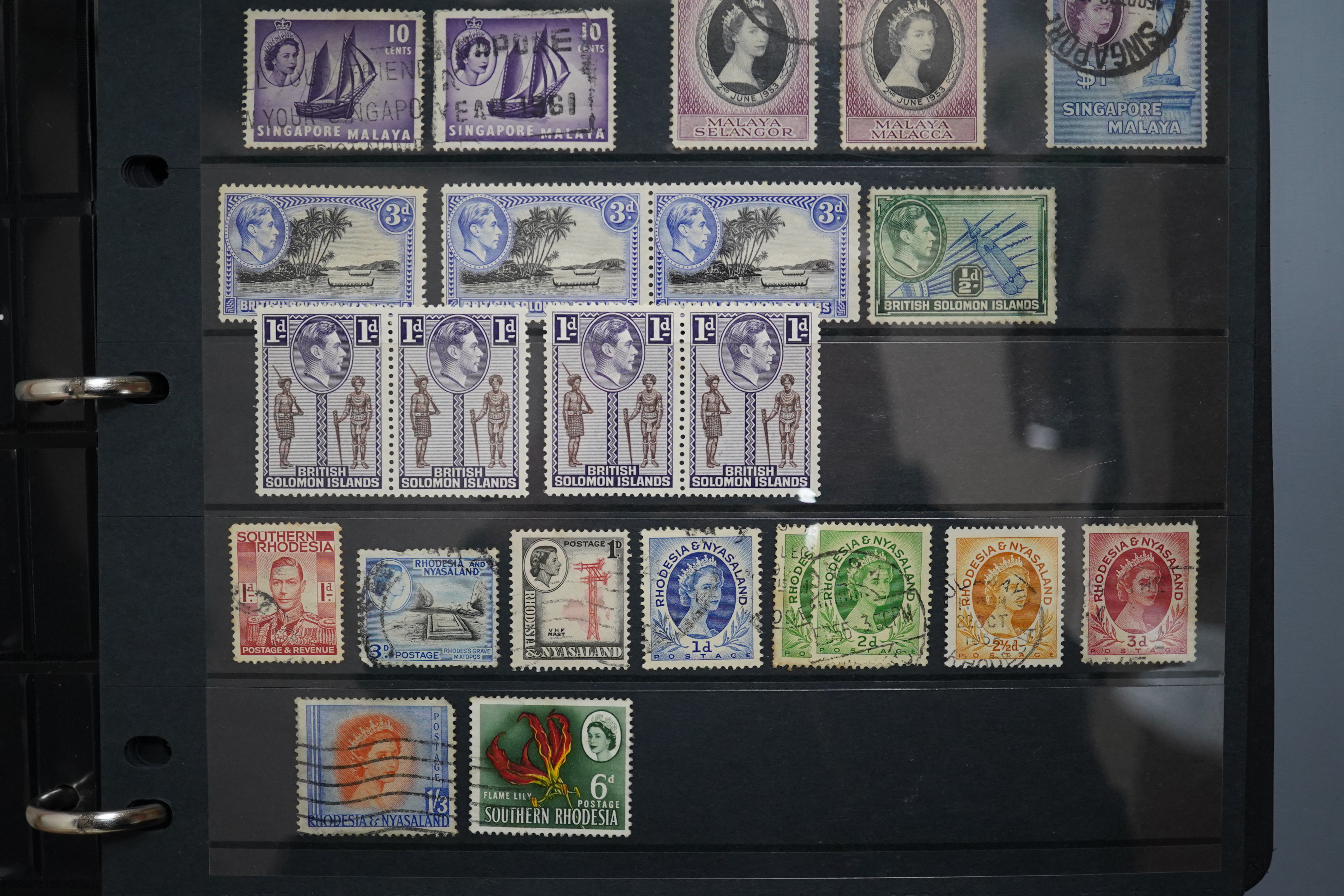 A four albums of mixed stamps, including world and commonwealth, first day covers and an empty album. Condition - varies